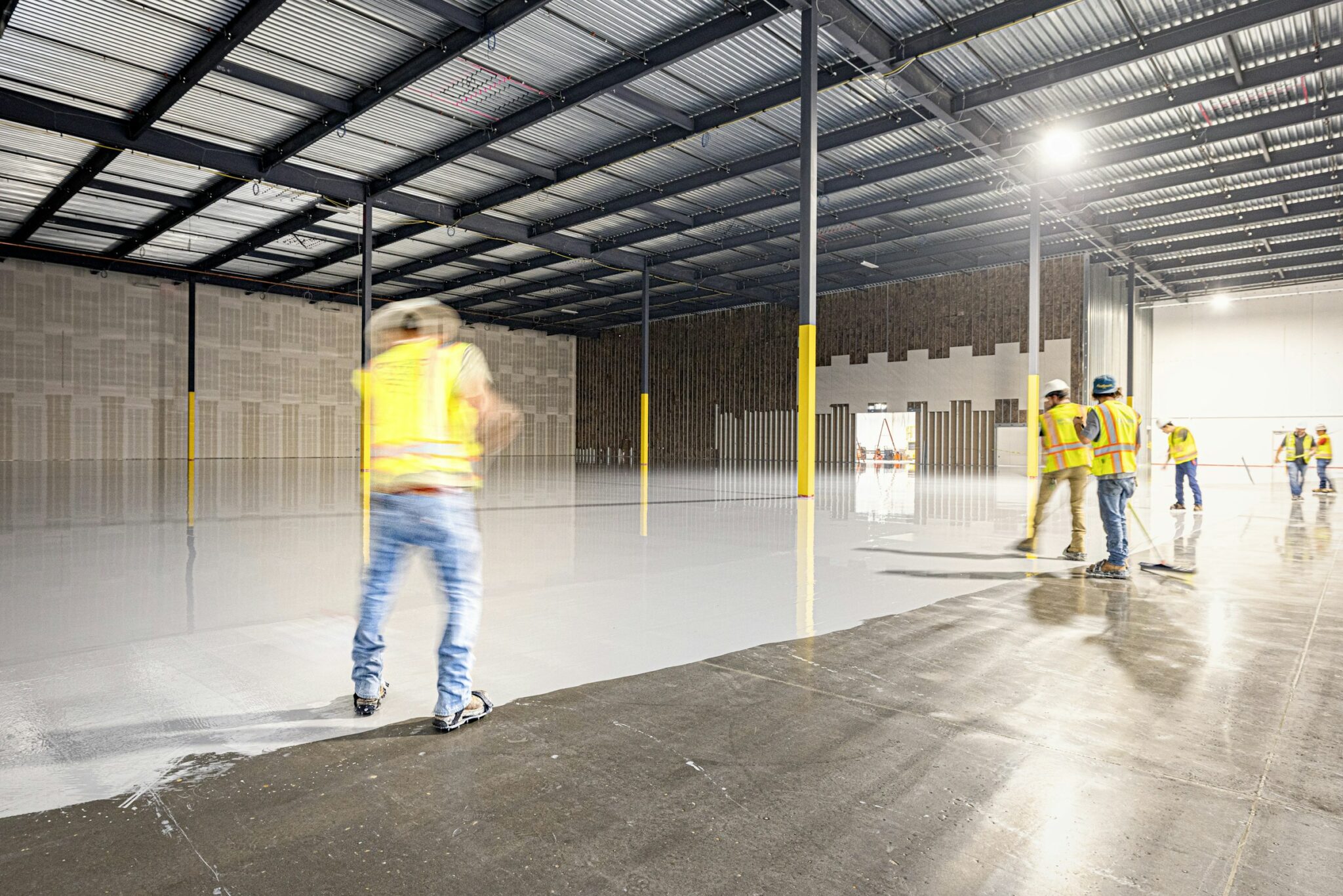 Crew applying a seamless coating