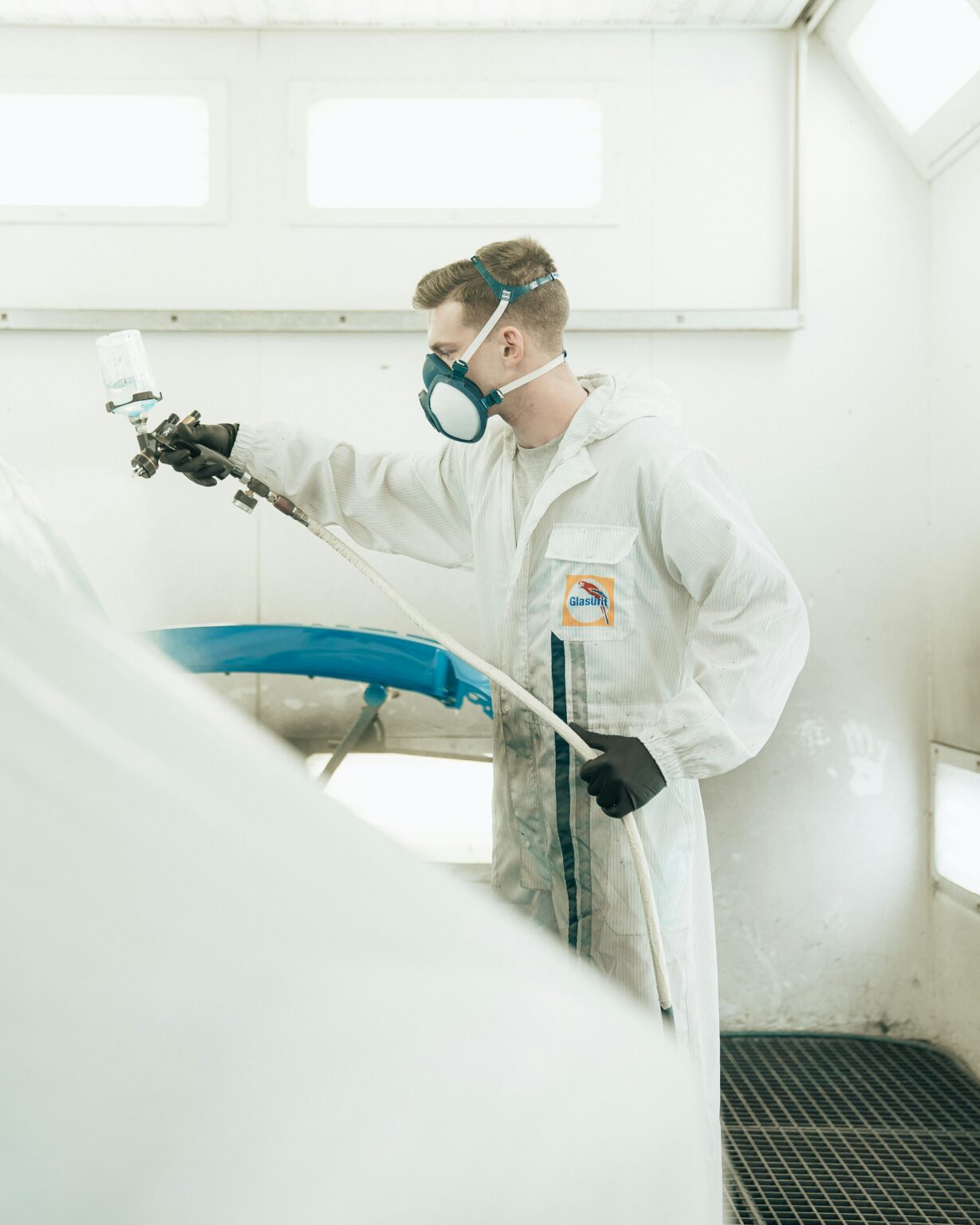 Applicator spraying a protective coating