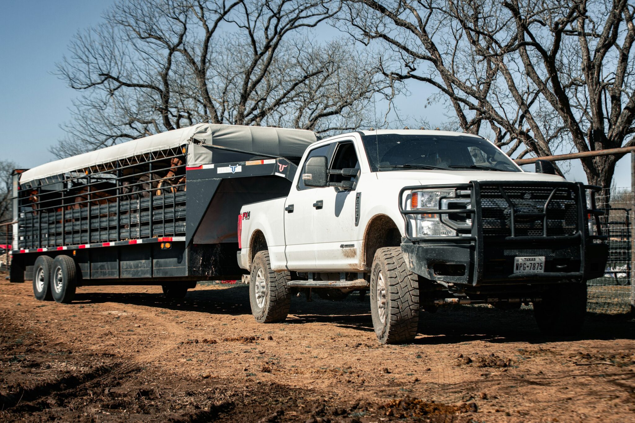 Pickup truck towing a work trailer